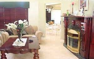 Living rm w/antique fireplace