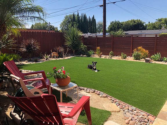 Quiet, private front yard, gated with wood fence in front