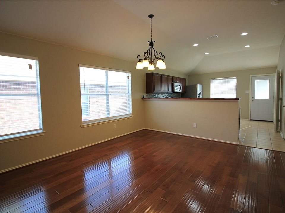 Formal dining with kitchen in the back.