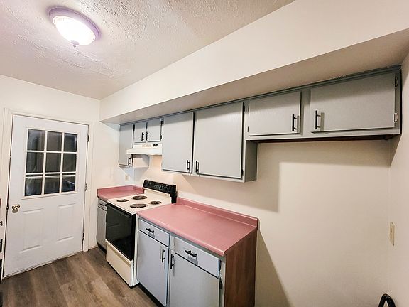 Brand new flooring and rear door exit to private deck overlooking the woods