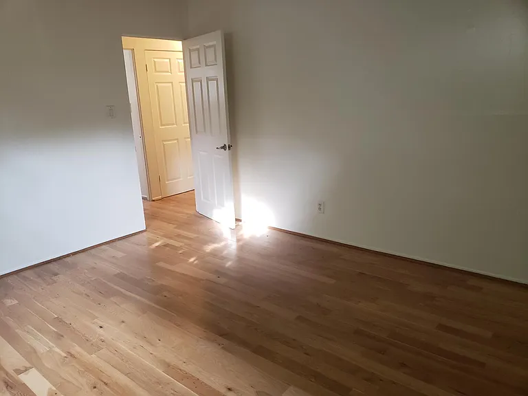 This view is from the master bedroom looking into the hallway. Smooth ceiling, over hood fan, central air, mirrored closet doors, private height window