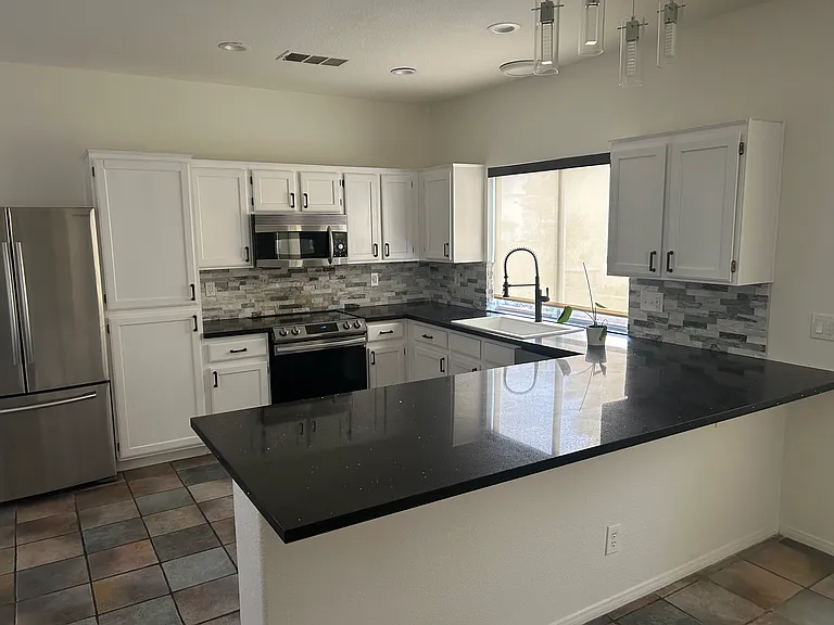New cabinets and countertops, stainless appliances