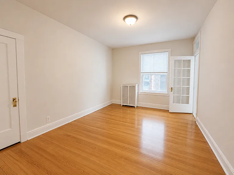 3rd bedroom with closet door and door leading into flex room. 15'2 x 11'2