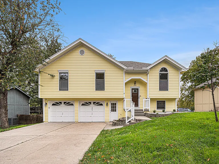 The front of the house welcomes you with a bright and inviting presence, creating a cheerful first impression and setting the tone for a warm home.