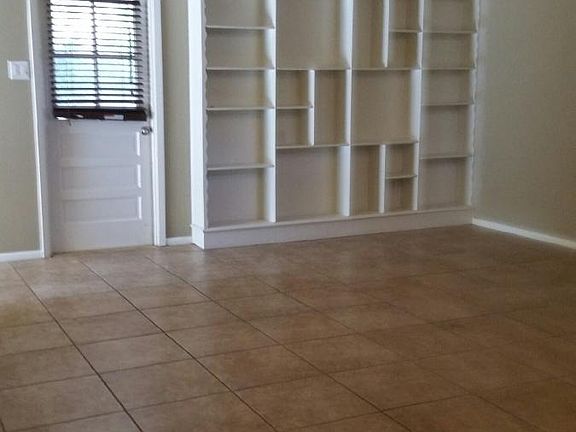 Built in shelves in living room with access to back patio