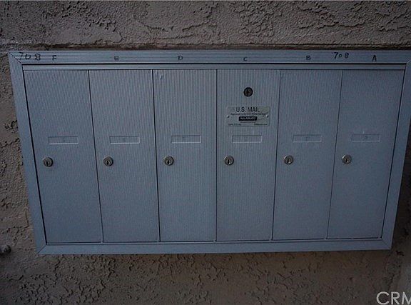 mailbox located outside of the front alley gate