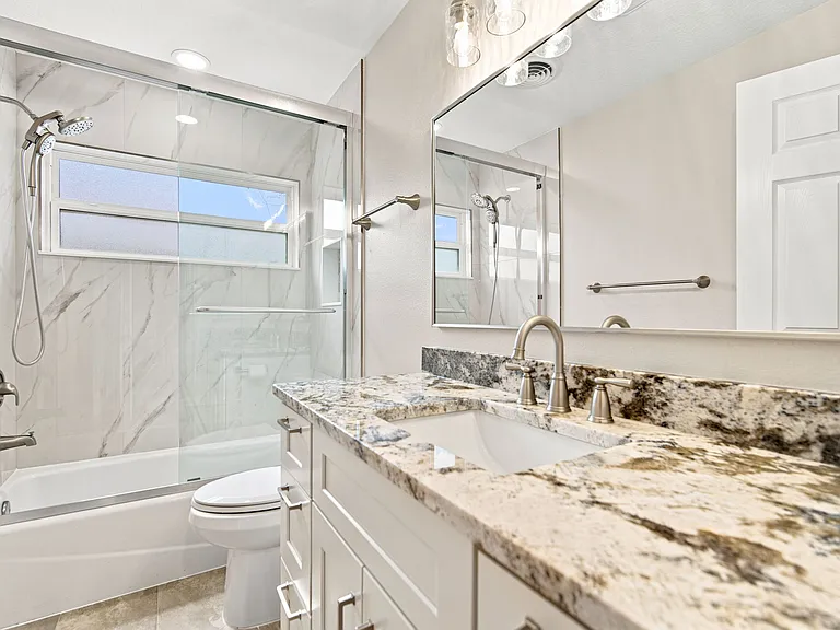 Hall bathroom with tub and shower combo