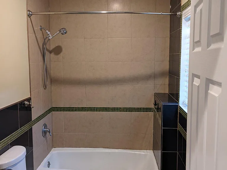 Bathroom; laundry behind door