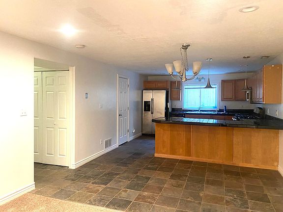 Kitchen table area and kitchen counter bar.