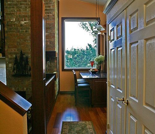 Walking from front door you are awe-struck with 8 foot window to back yard