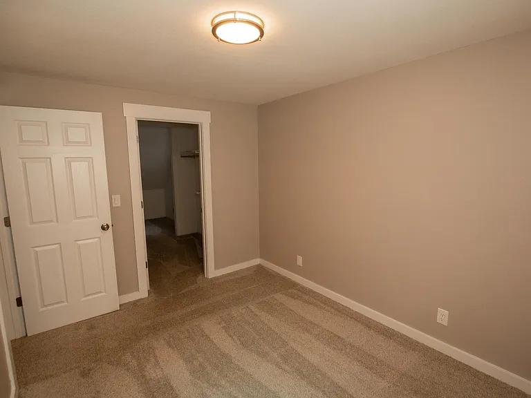 Small upstairs bedroom with large double walk in closet.