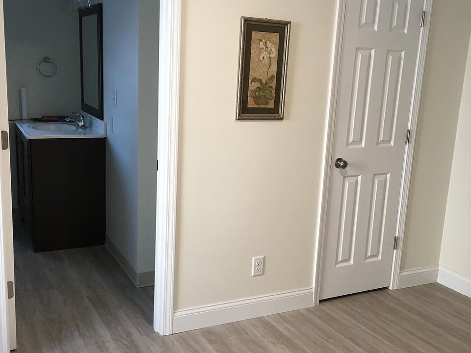 Bedroom with adjacent bathroom and closet