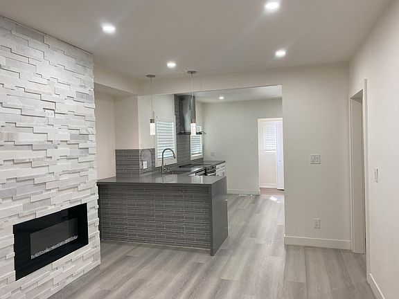 The Family Room/Dining Room and the Kitchen which is behind the counter.