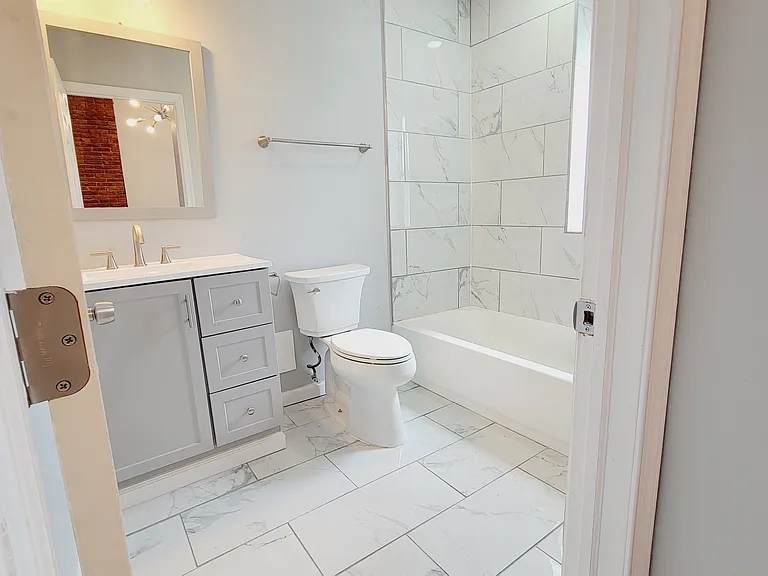 Full bathroom with tub shower combo