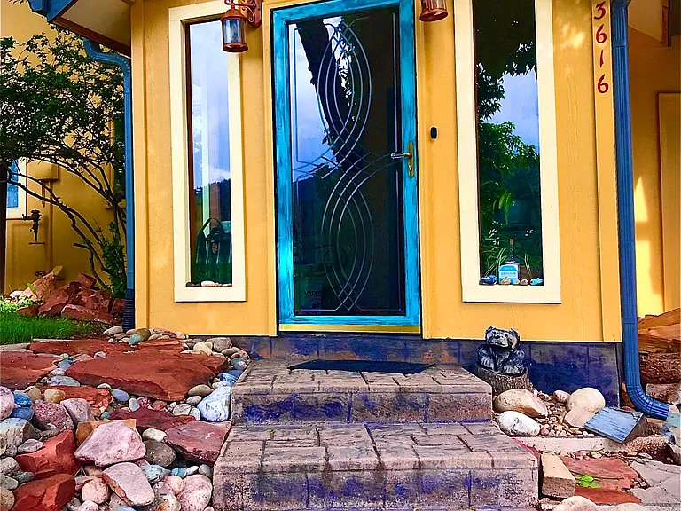 Entrance has security/wildlife cameras.