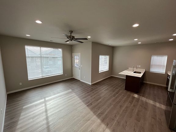 Spacious living room/kitchen area.