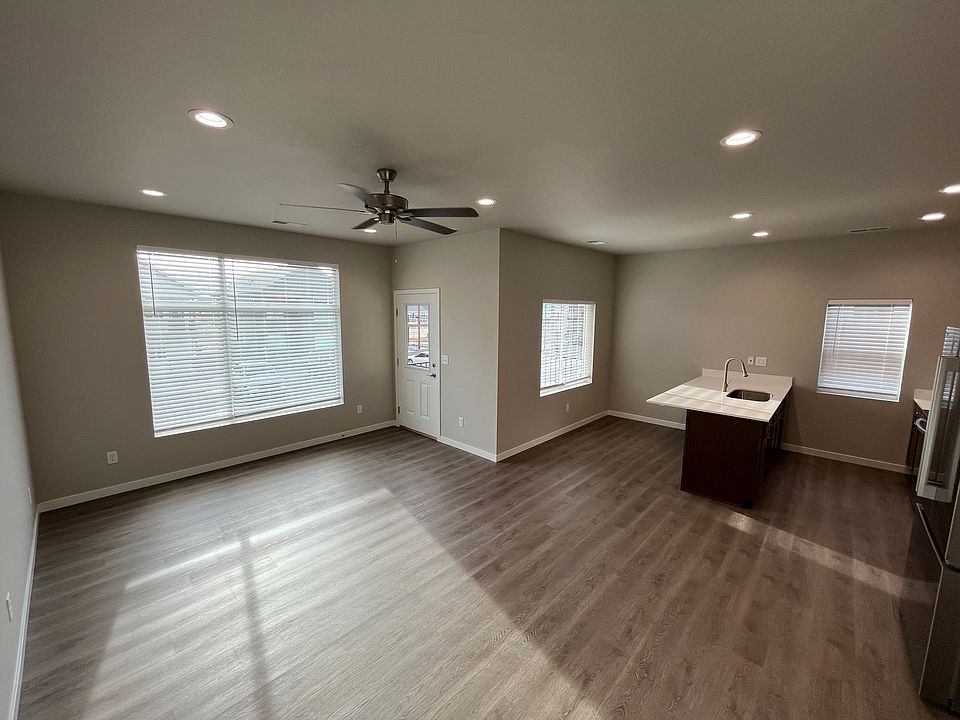 Spacious living room/kitchen area.