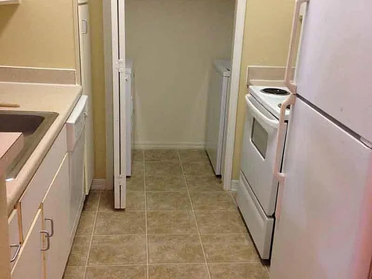 Washer and dryer are located in the unit along with a stove and a dishwasher.