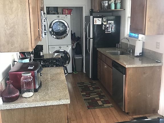 Kitchen with laundry and stainless appliances