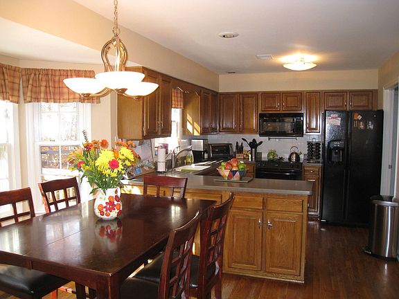 Open Kitchen with Hardwood Floor 