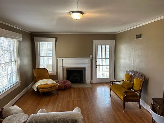 living area view facing west toward the sunroom. furniture will be different.