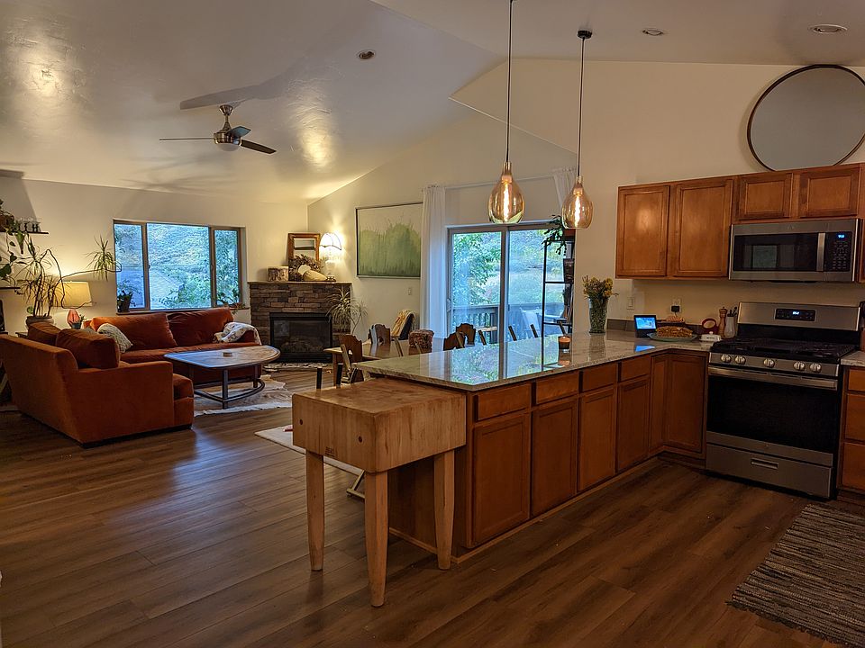 Main living room and kitchen (shown furnished for scale, but this listing is not furnished)