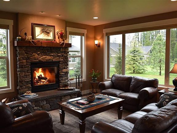 Open concept living room with real wood burning fireplace