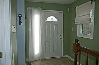 Entry hall with new ceramic flooring.