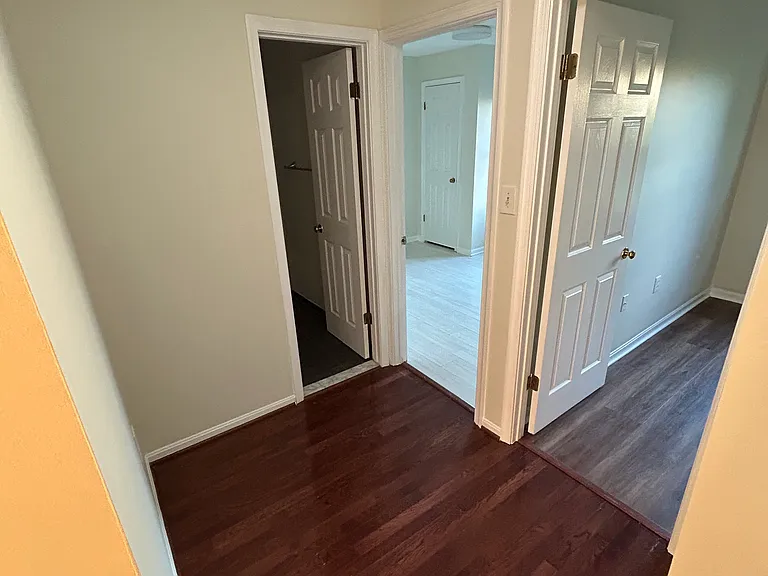 hallway of the other two bedrooms and full bathroom