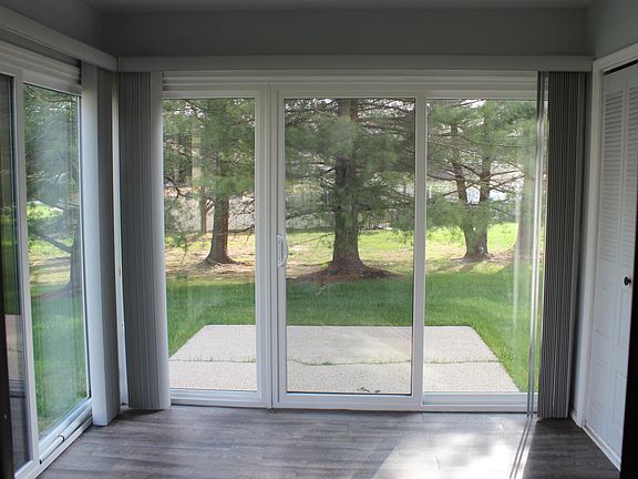 SUNROOM OFF THE LIVING ROOM