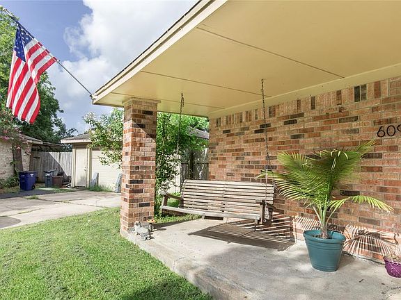 Relax and enjoy your new neighborhood from this charming front porch.