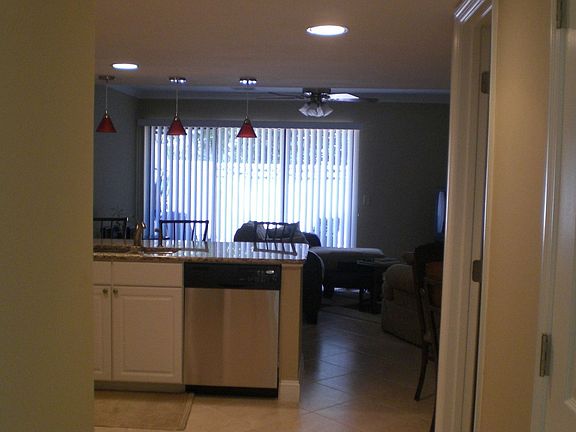 from inside the front door looking at the kitchen and living room beyond
