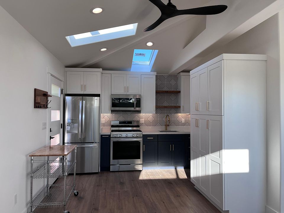 Kitchen with movable kitchen island for additional work space!