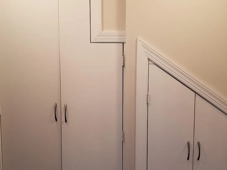 Under stair storage that can hold a bicycle and big suitcases