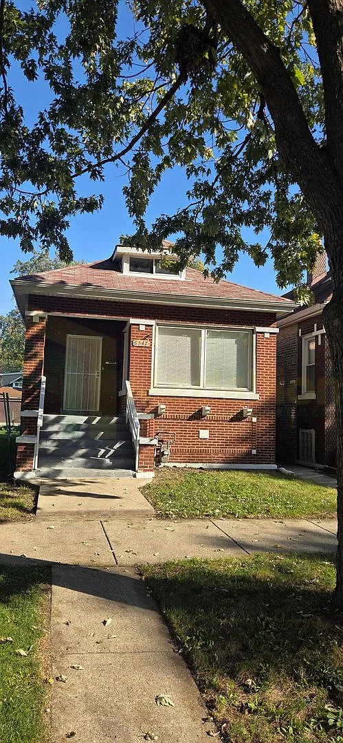 5-Bedroom Brick Bungalow with Finished Basement, Bonus Room, and Fenced Backyard — Photo 1