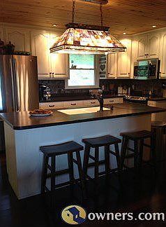 Kitchen area with sink in bar