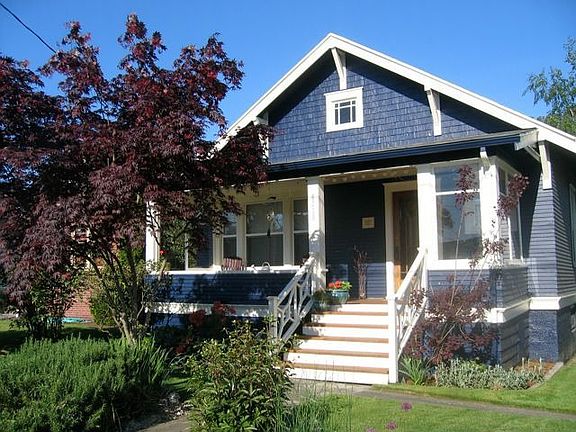 Sip coffee and say "hello" to your neighbors from your rocking chair front porch!