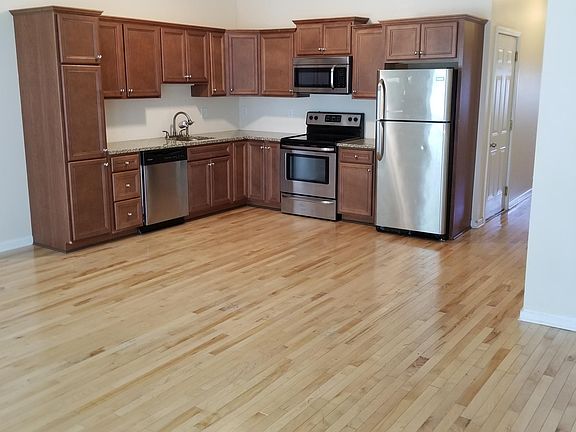 open concept kitchen and living room granite counter top