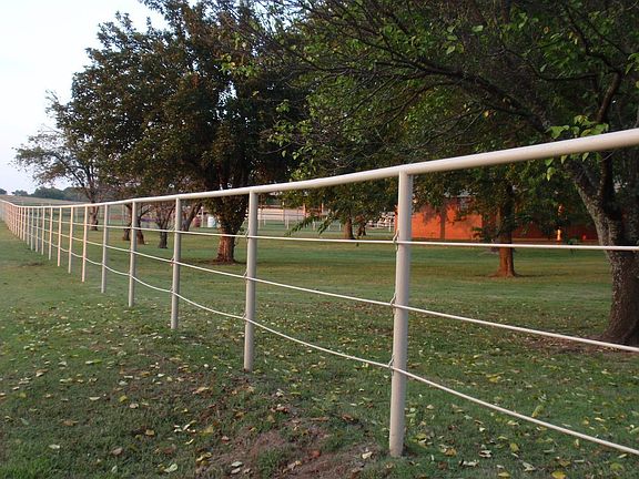 Pipe & Cable fence surrounds the property