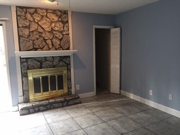 Living Room w/large storage closet and sliding glass doors t