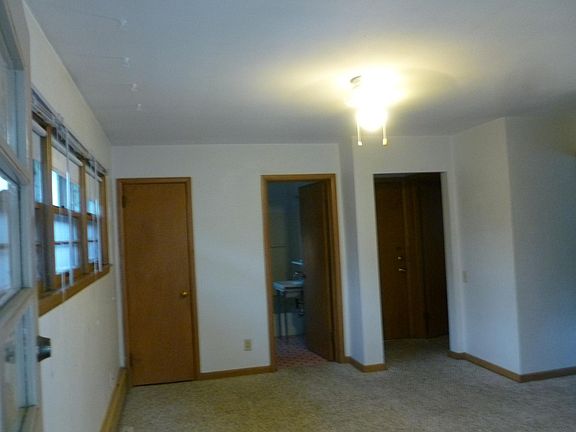 Living room, closet, bathroom, entrance . Kitchen by entrance, bedroom to right.