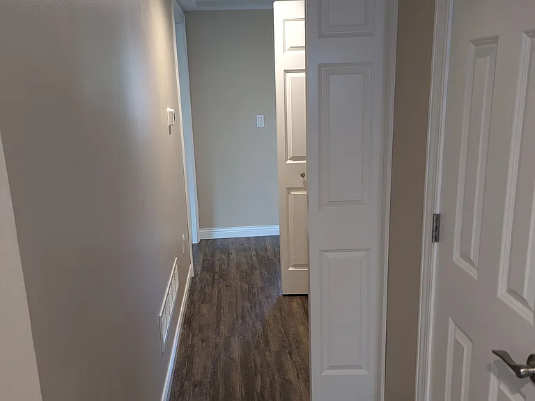 hall wall to laundry and master