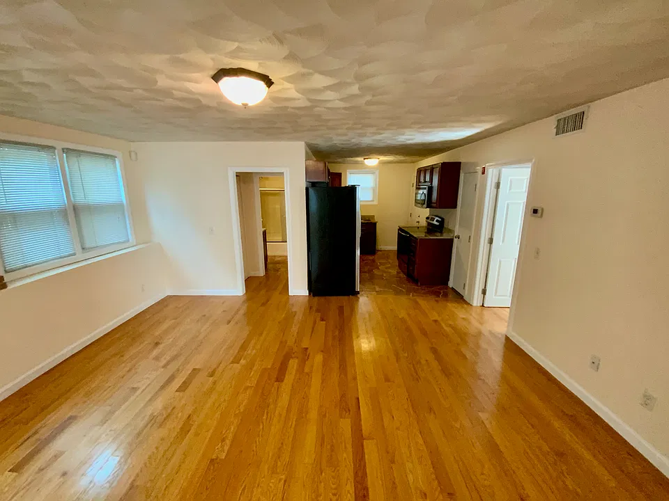 This is from the front door. This is showing 1/2 of the living room, the kitchen, the entrance to the bathroom (on the left) and door to one of the bedrooms