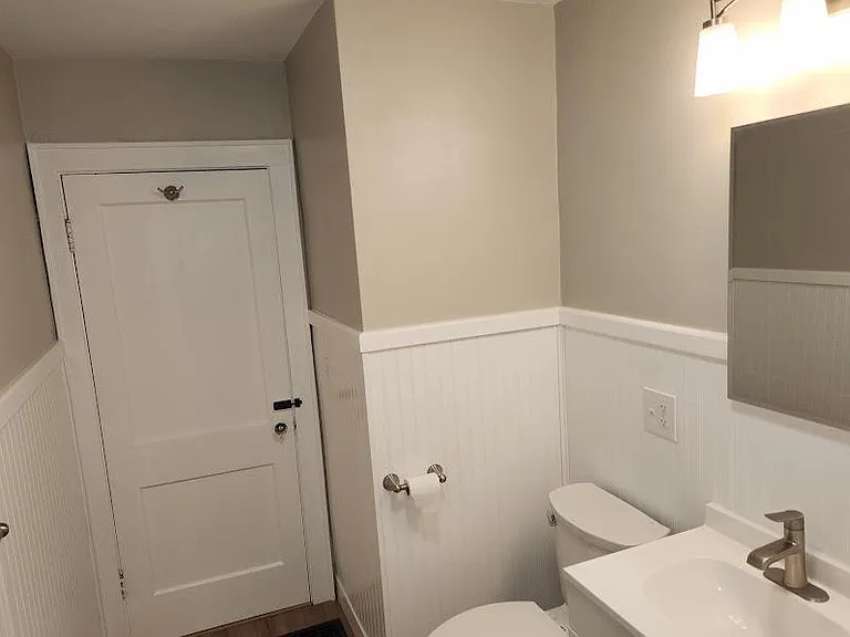 New Upstairs Bath, wainscoting, new tub/shower, Wi-Fi ceiling fan, new base & medicine cabinets, sink, faucet, toilet, lighting, luxury vinyl flooring.