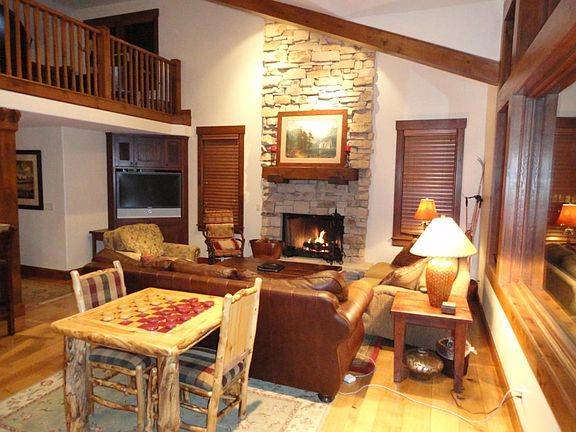 Great room with 20-foot vaulted ceiling and fireplace