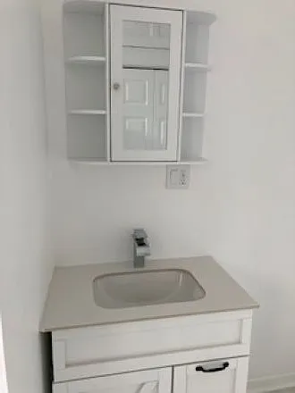 Sink and Cabinet in bathroom