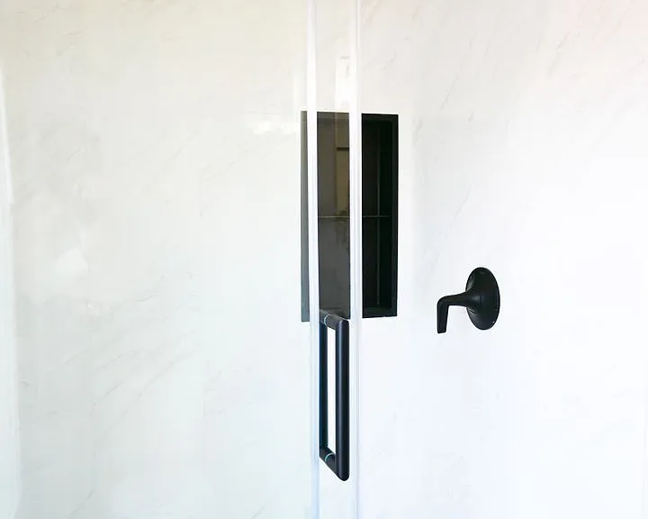 Luxury walk-in shower in bathroom at Lyric Tonwhomes.