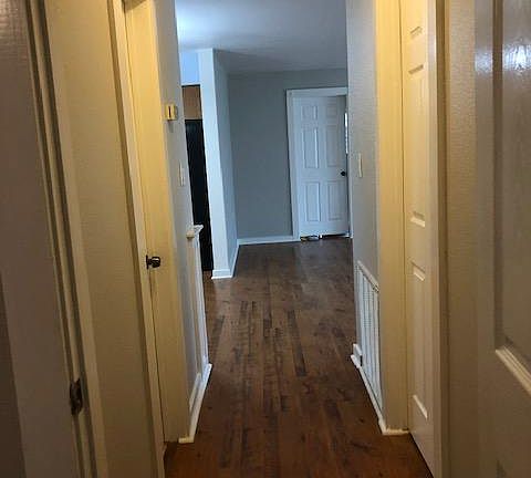 HALLWAY: This picture was taken coming out of the electric outlet room. Third bedroom to the right and bathroom to the left.