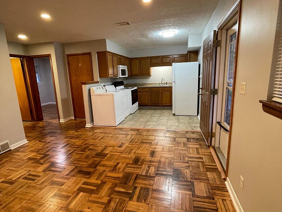 Open concept living room & kitchen. Room for a small table for dining in kitchen area.