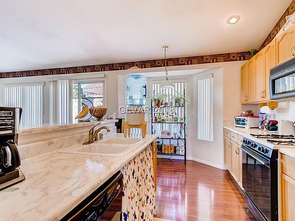 OPEN KITCHEN LOOKING INTO FAMILY ROOM
